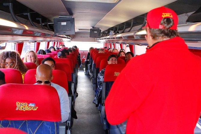 Cape Point and Boulder's Penguins Full Day Tour - Muizenberg’s colorful beach and the road south
