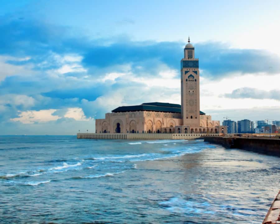 From Marrakech: Casablanca Tour with Hassan II Mosque Visit - Inside Hassan II Mosque beside the Atlantic