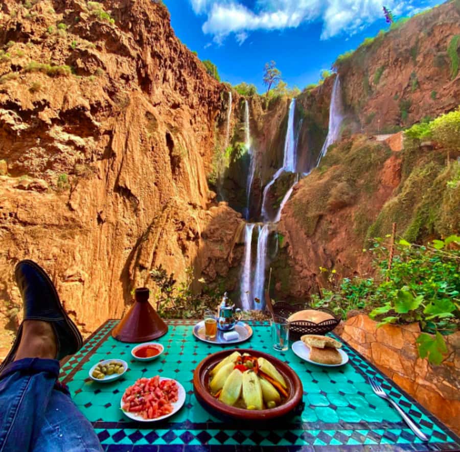 From Marrakech:Ouzoud Waterfalls Day Trip with Boat Tour - First views of the red cliffs and olive groves
