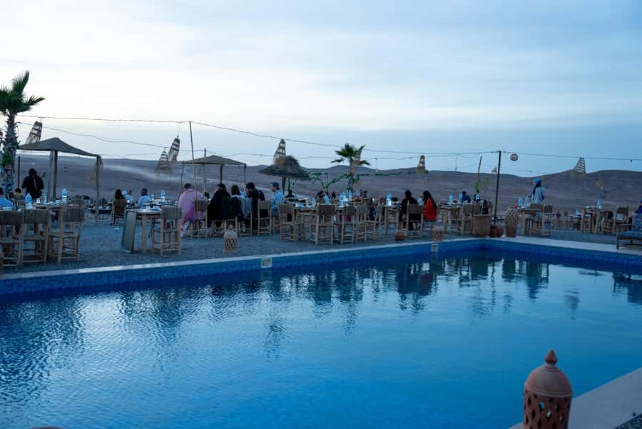 From Marrakech: Sunset Desert Tour with Camel Ride & Dinner - Camel riding across Agafay’s stony hills