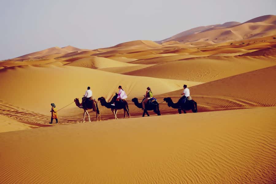 From Merzouga: Desert Overnight in Heated Tent & Camel Ride - Tea, tents, and the first look at camp