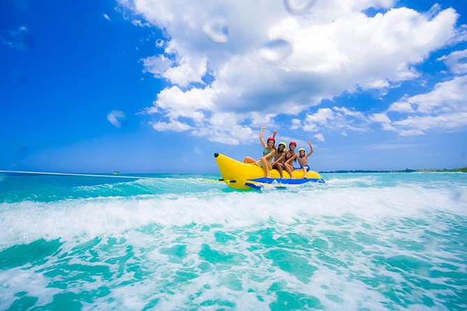 Hurghada: Orange Bay, Snorkeling, Watersports, Lunch & Drinks - Lunch, fruit, and a busy boat deck