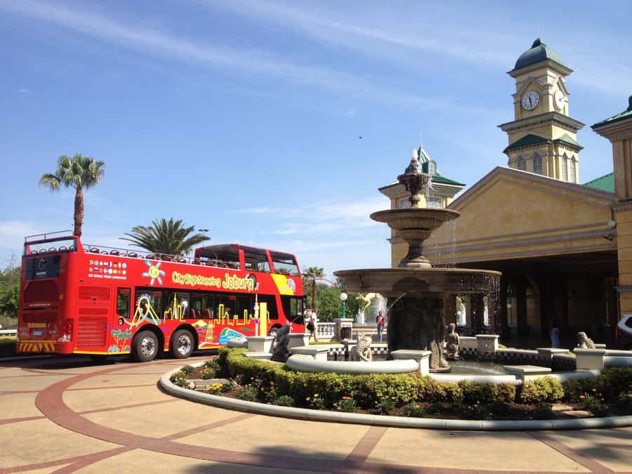 Johannesburg: Hop-On Hop-Off Bus with Optional Soweto Tour - Audio, guides, and comfort on the bus