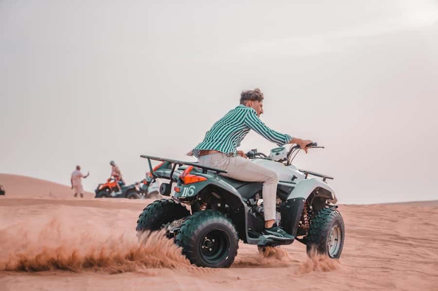 Marrakech: Agafay Desert Quad Bike with Camels & Dinner Show - Music, campfire, and the fire show