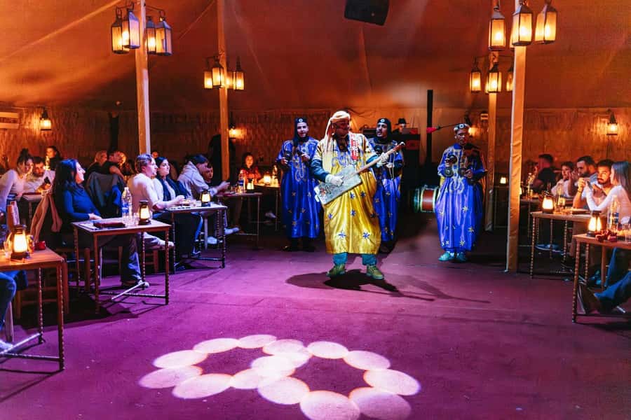 Marrakech: Agafay Desert Retreat, Tent, Dinner, Show & Pool - Music, dancing, fire, and guitar
