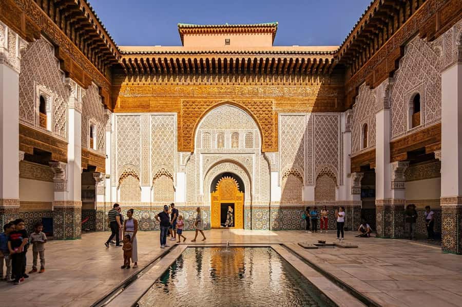 Marrakech: Ben Youssef, Secret Garden, & Souks Walking Tour - Jemaa el-Fnaa gives you the first taste of Marrakech