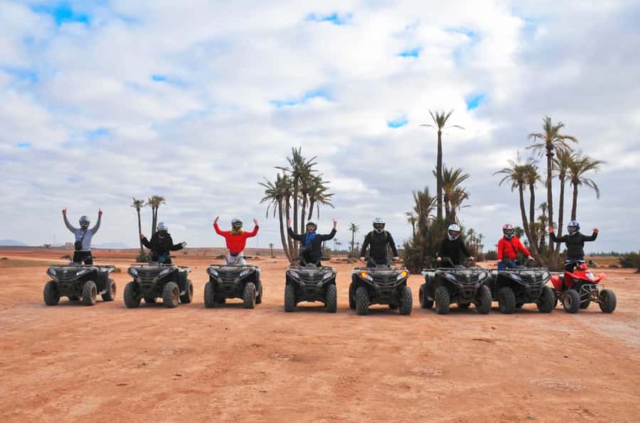 Marrakech Desert & Palm Grove Quad Bike Tour - Riding through palms, sand, and rocky ground