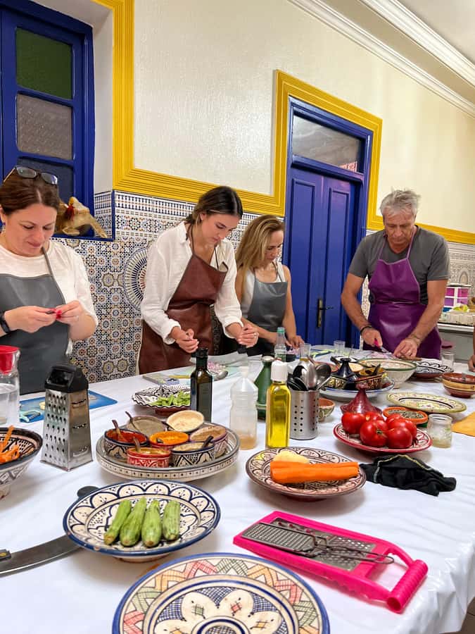 Marrakech: Traditional Moroccan Cooking Class & Market Visit - Preparing salads, tagines, and dessert
