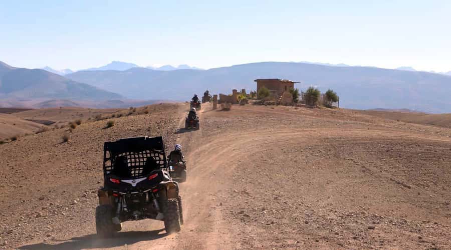 Marrakesh: Agafay Desert Quad & Camel Tour with Dinner - Quad biking across rocky tracks and hills