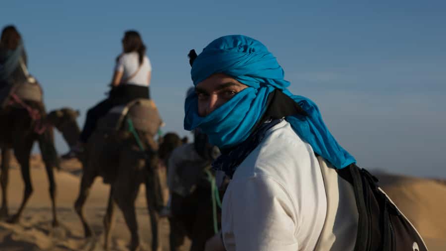 Merzouga Overnight Stay in a Berber Tent and Camel Ride - Sunset on the dunes, with one practical warning