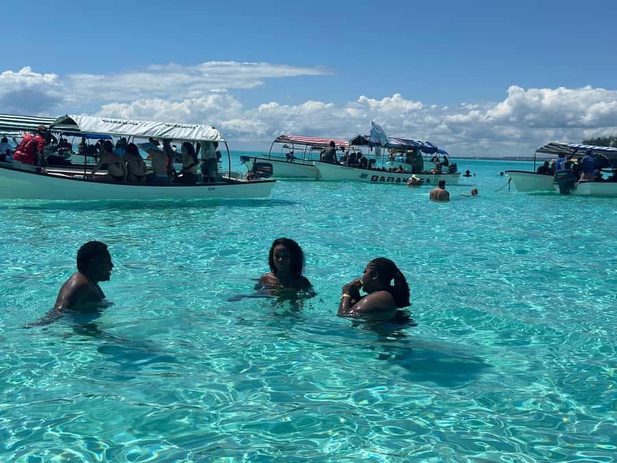 Zanzibar: Mnemba Island Dolphin and Snorkeling Tour - The ride back and what the price covers